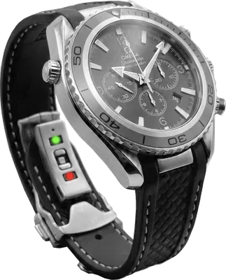 Stealthy watch attachment clipped to a wristwatch strap